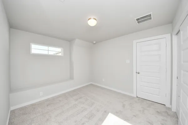 a view of an empty room and window