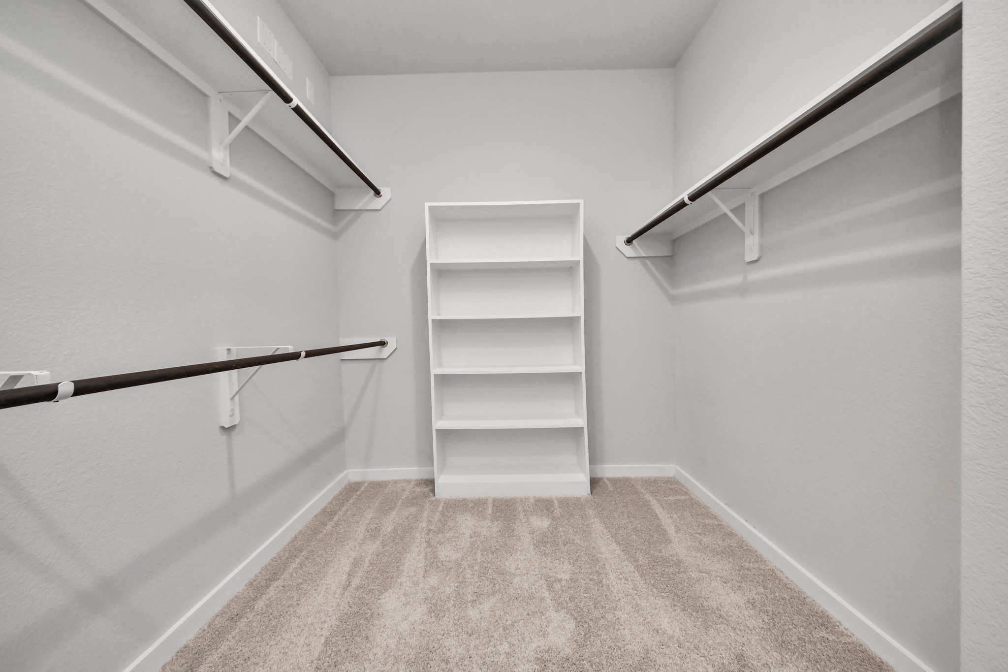 2946 Burris Park Drive Spring, TX 77373 - Photo 29 of 45 Walk-in closet that epitomizes luxury and practicality. This generously sized space features built-in shelving, offering abundant room for impeccable organization. High ceilings and recessed lighting create a bright and welcoming ambiance.