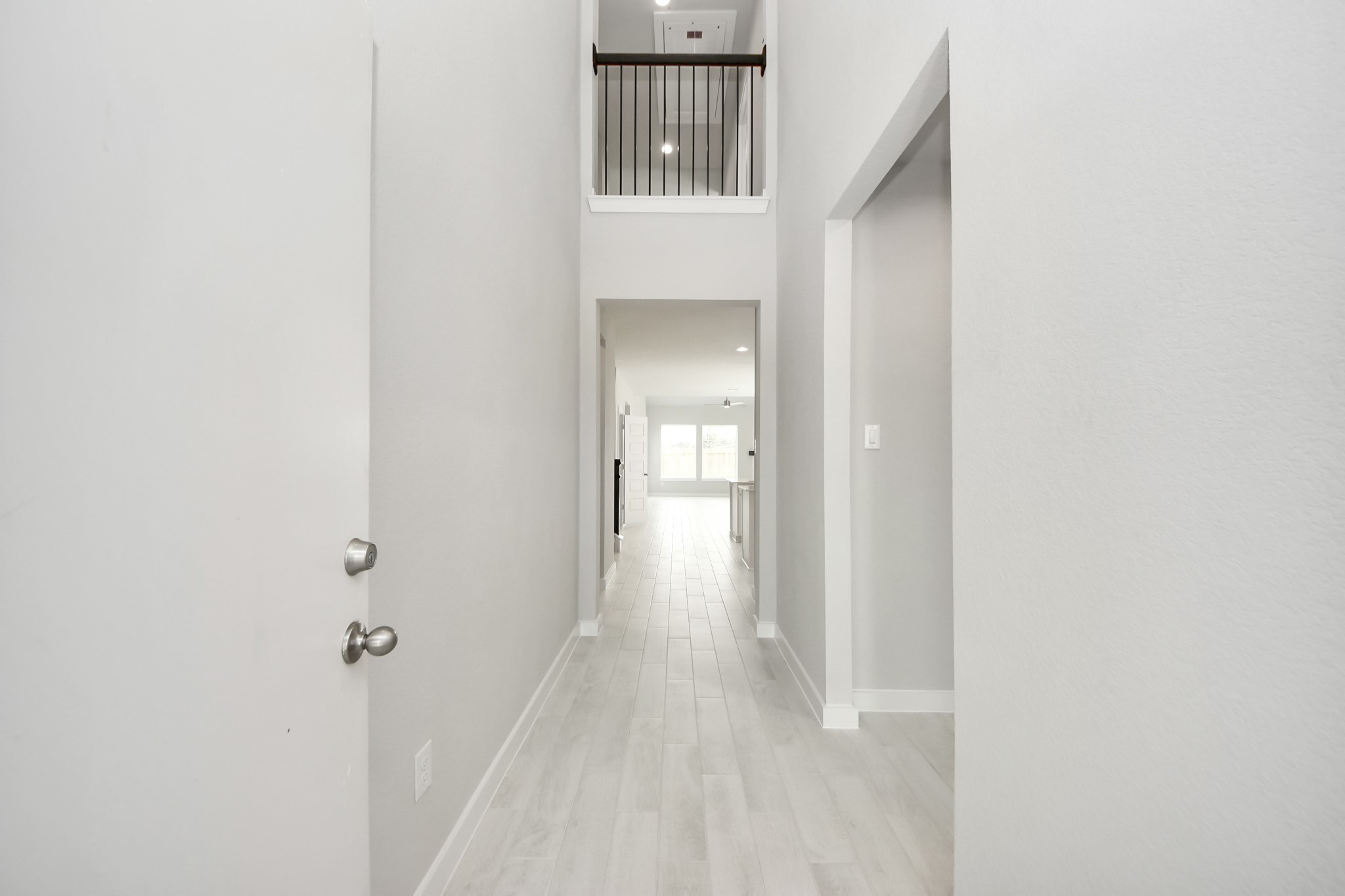 2946 Burris Park Drive Spring, TX 77373 - Photo 3 of 37 a view of a hallway with wooden floor and entryway