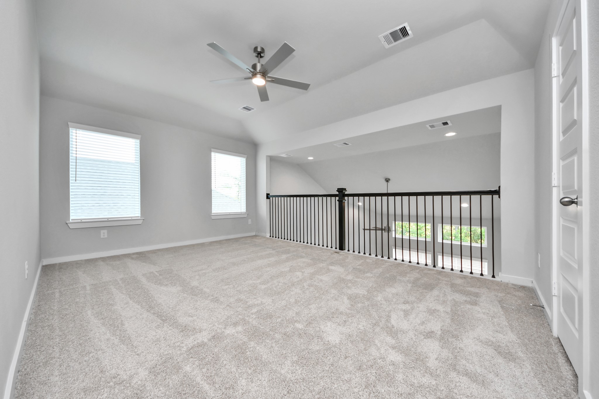 2946 Burris Park Drive Spring, TX 77373 - Photo 31 of 45 Come upstairs and enjoy a day of leisure in this fabulous game room! This is the perfect hangout spot or adult game room! Features plush carpet, high ceilings, custom paint and windows for plenty of natural light.