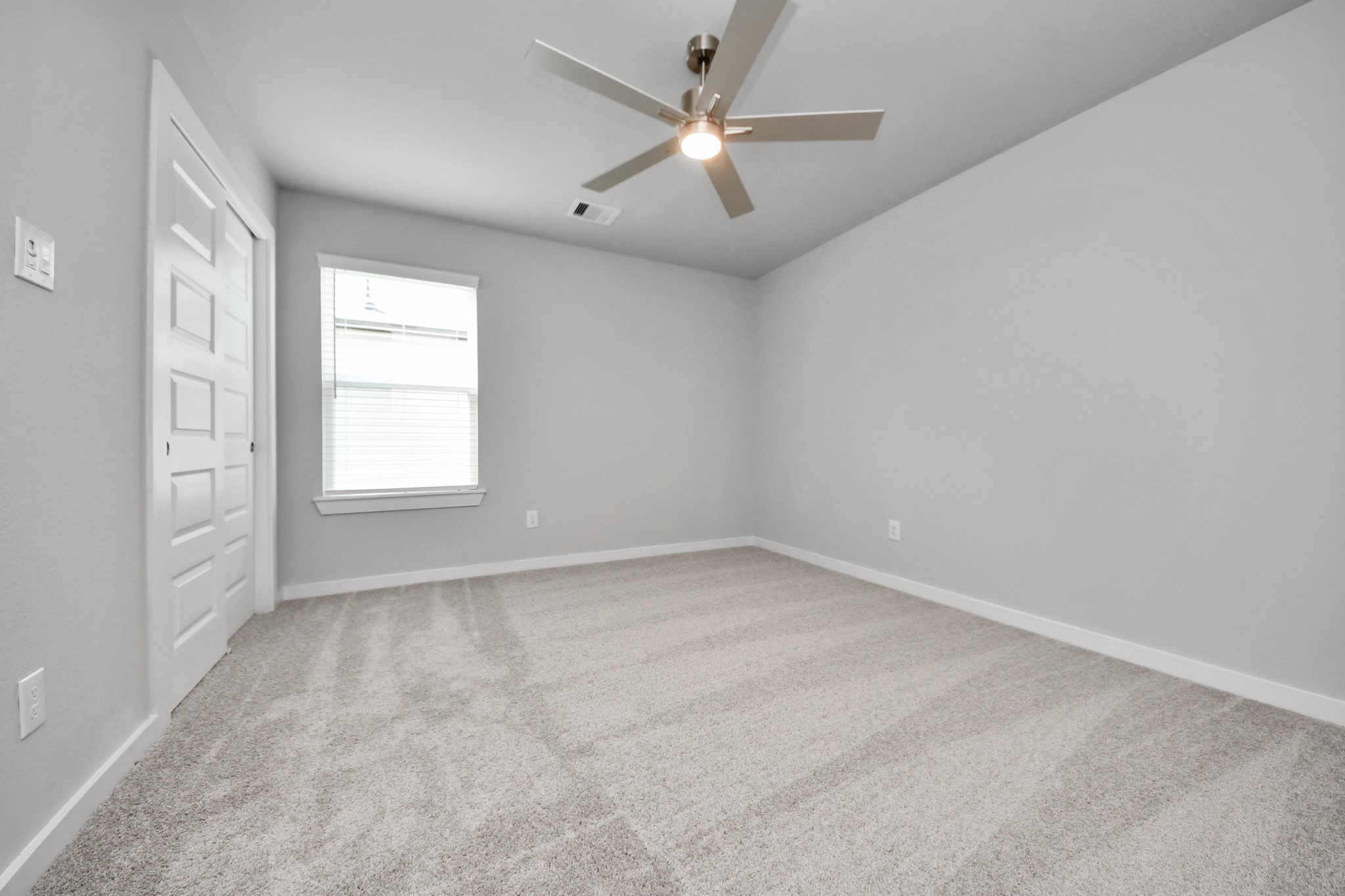 2946 Burris Park Drive Spring, TX 77373 - Photo 37 of 45 Generously sized secondary bedrooms featuring spacious closets, soft and inviting carpeting underfoot, large windows allowing plenty of natural light, and the added touch of privacy blinds for your personal retreat.