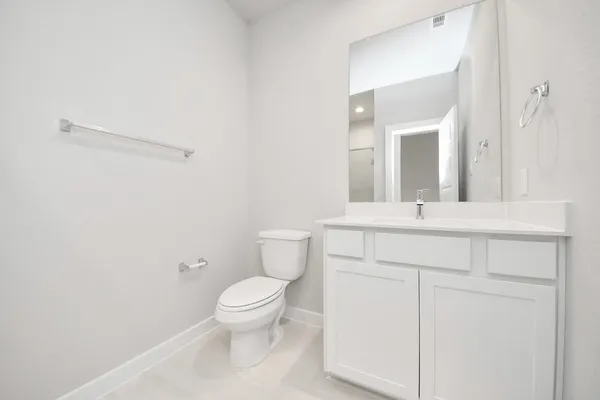 a large white kitchen with a large window