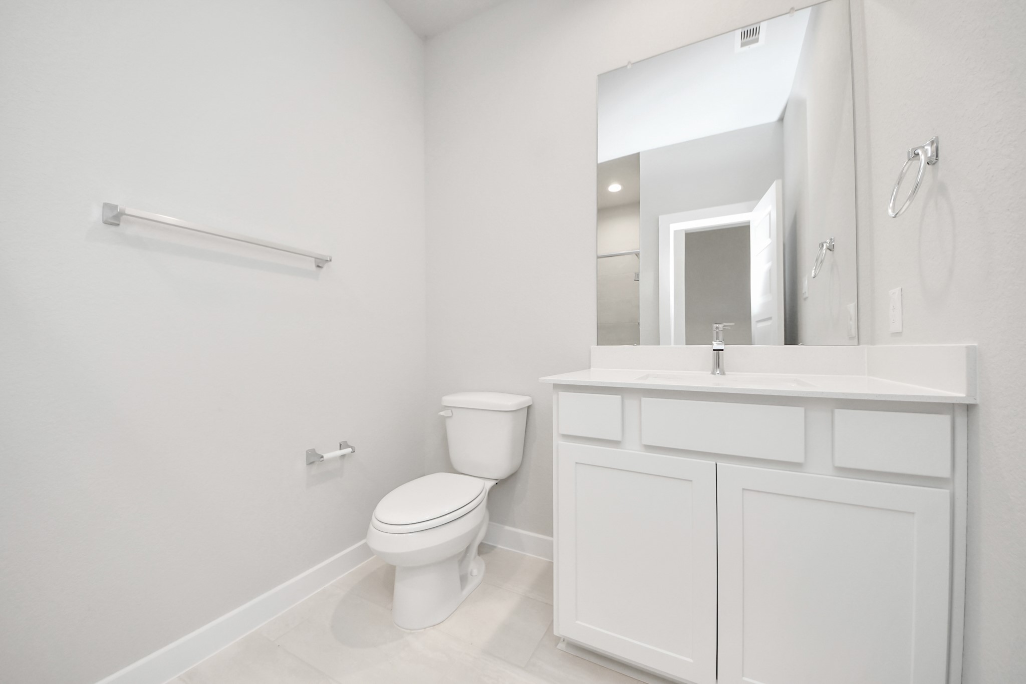 2946 Burris Park Drive Spring, TX 77373 - Photo 5 of 37 a bathroom with a toilet sink vanity and mirror