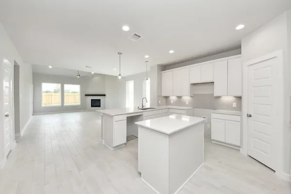 a view of kitchen with wooden floor and windows