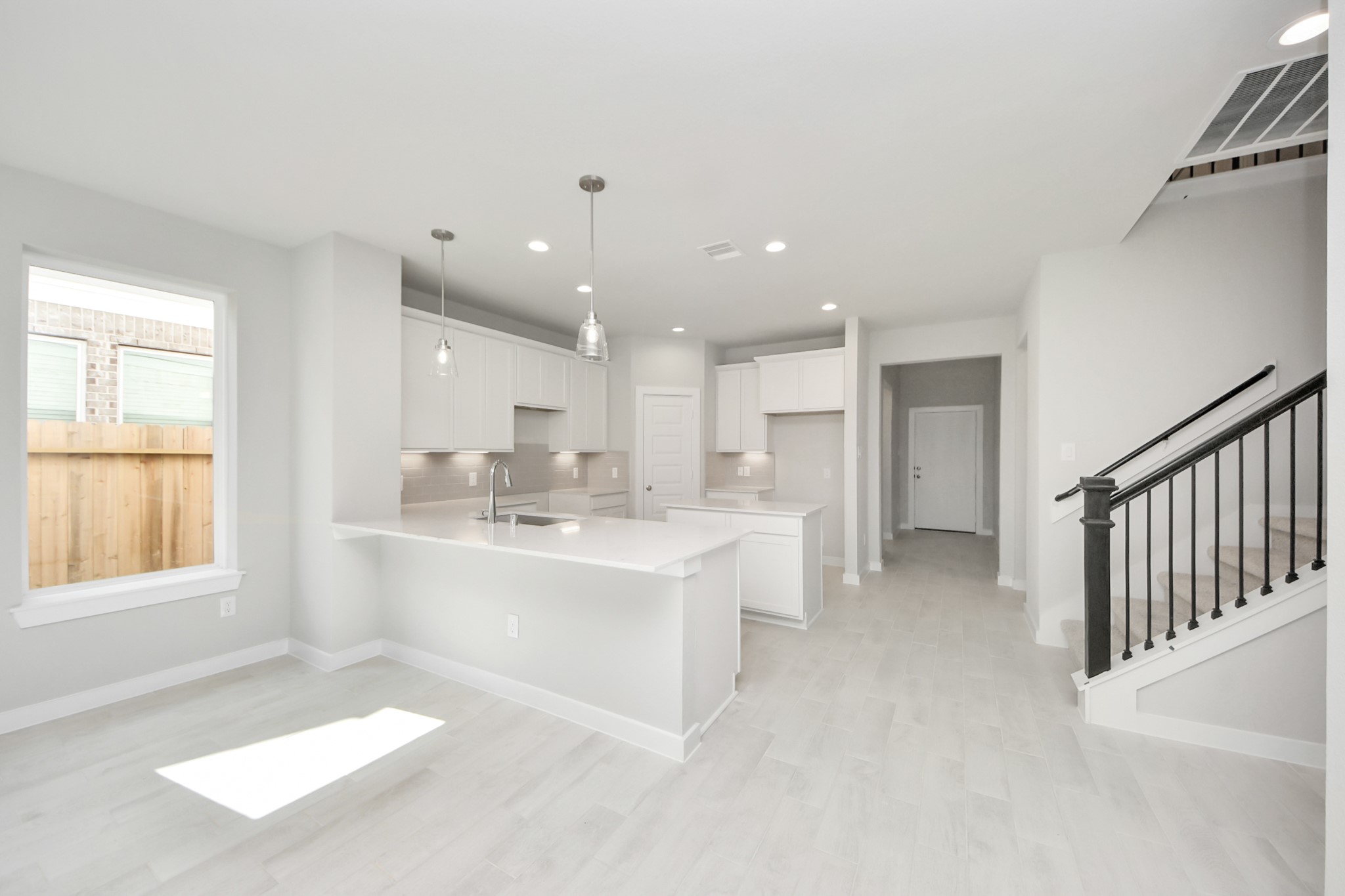 2946 Burris Park Drive Spring, TX 77373 - Photo 8 of 37 a view of kitchen with wooden floor and windows