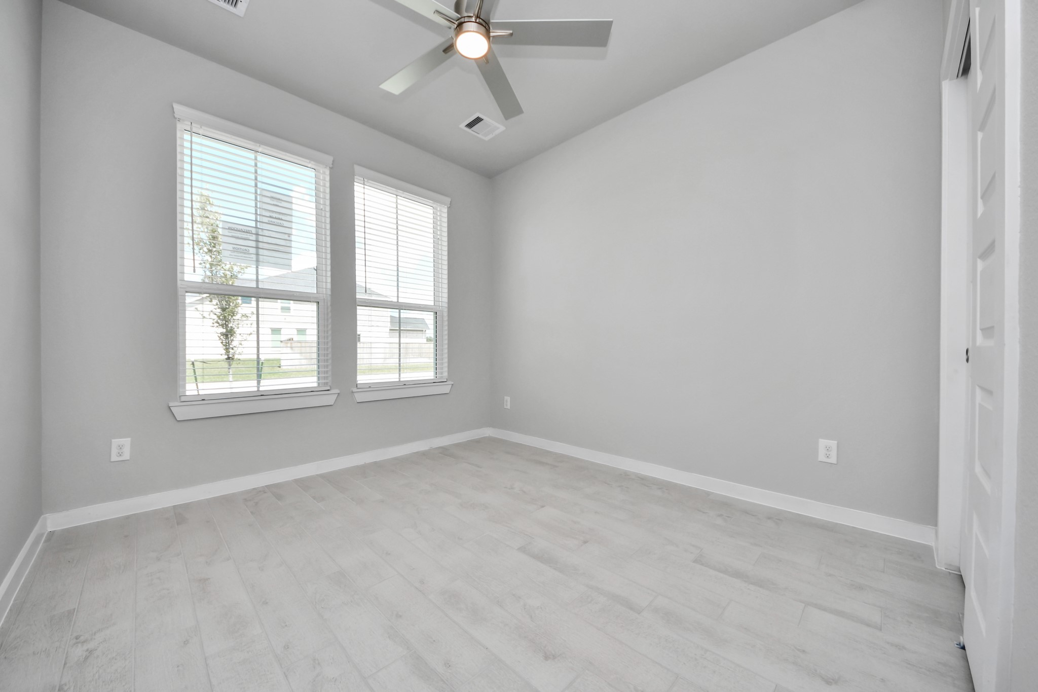 2946 Burris Park Drive Spring, TX 77373 - Photo 8 of 45 Generously sized secondary bedrooms featuring spacious closets, soft and inviting carpeting underfoot, large windows allowing plenty of natural light, and the added touch of privacy blinds for your personal retreat.