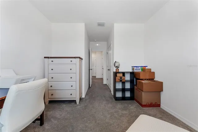 a room with furniture and white walls