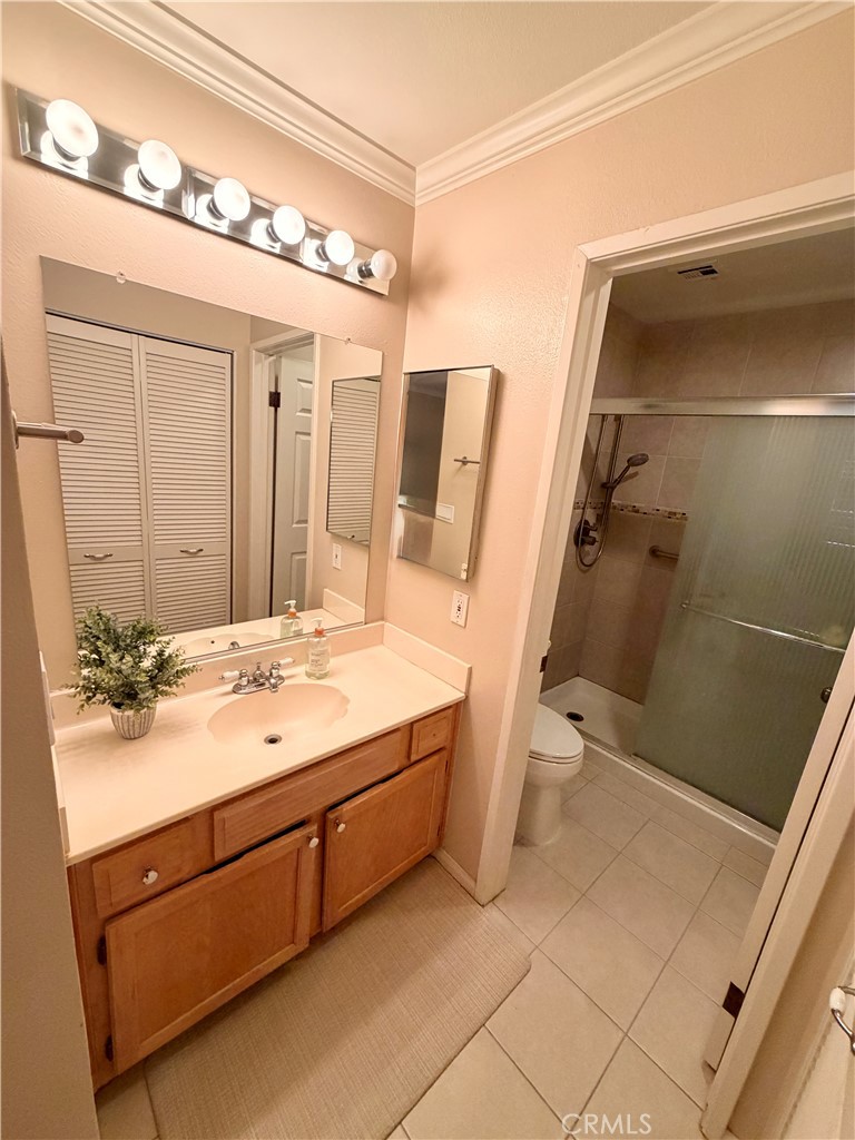 19804 Sandpiper Place, Unit 9 Newhall, CA 91321 - Photo 12 of 27 a bathroom with a sink and mirror