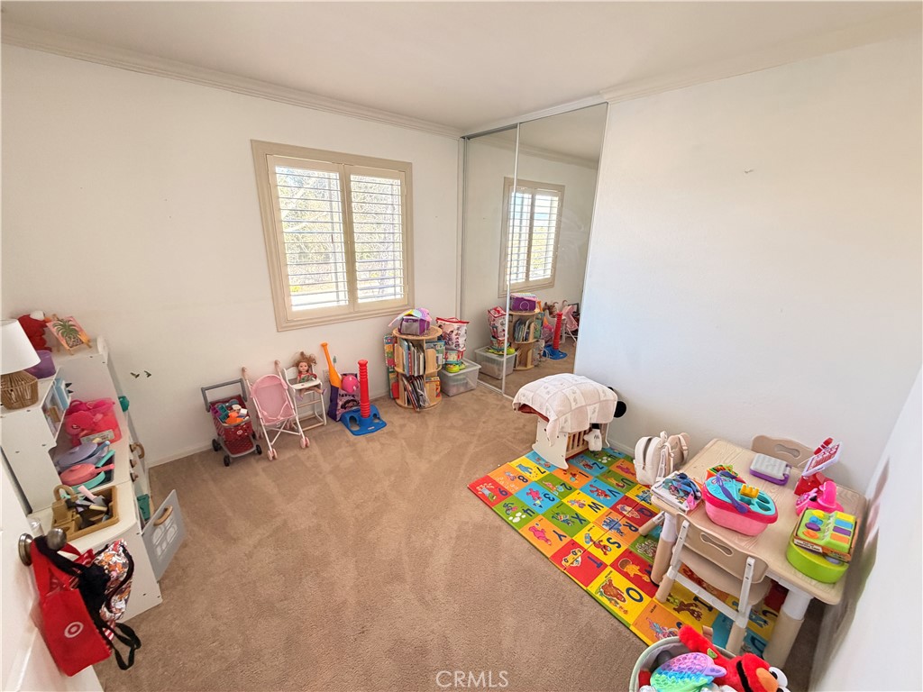19804 Sandpiper Place, Unit 9 Newhall, CA 91321 - Photo 14 of 27 a living room with lots of furniture and a couch
