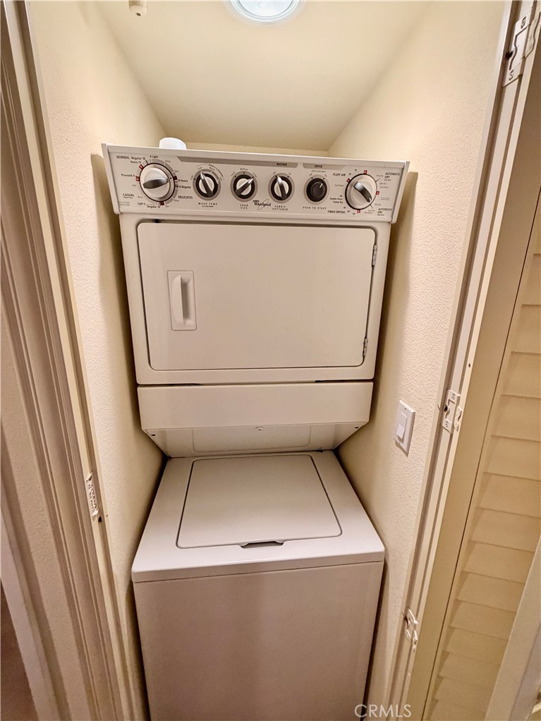 19804 Sandpiper Place, Unit 9 Newhall, CA 91321 - Photo 18 of 27 a utility room with dryer and washer
