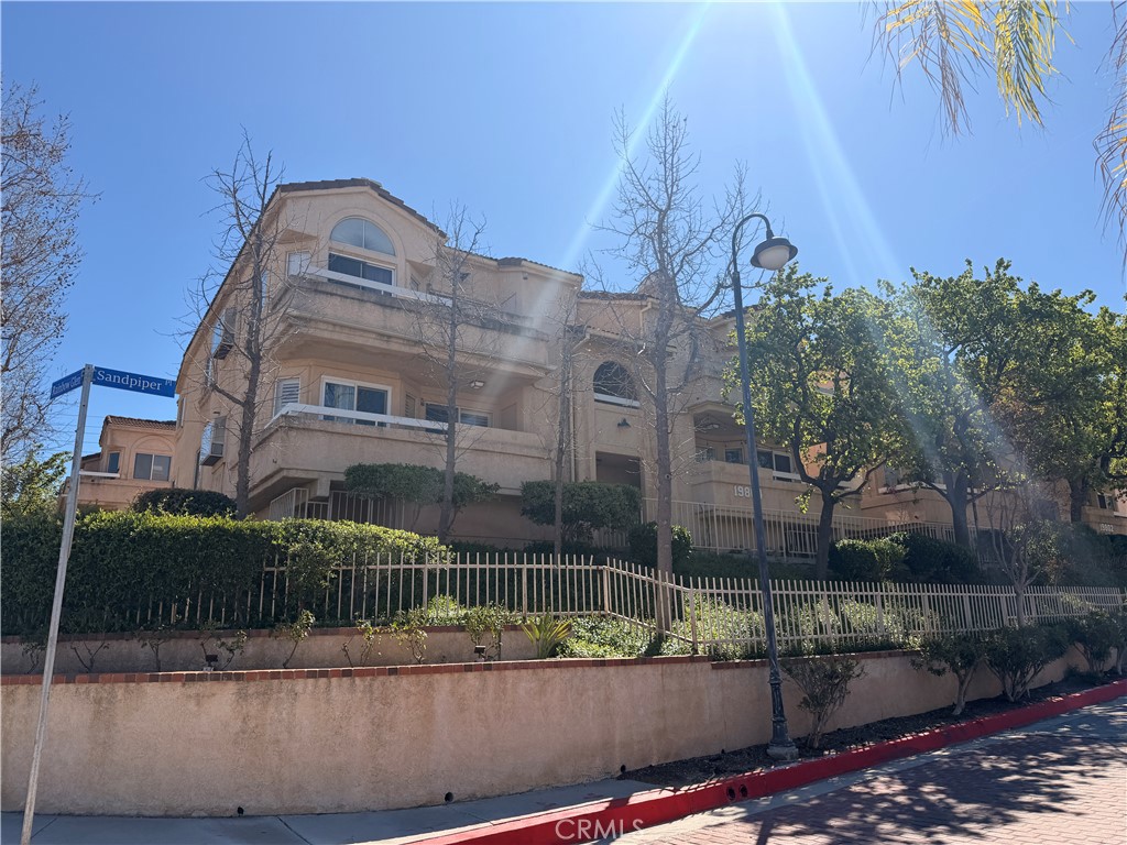 19804 Sandpiper Place, Unit 9 Newhall, CA 91321 - Photo 19 of 27 a view of a multi story building