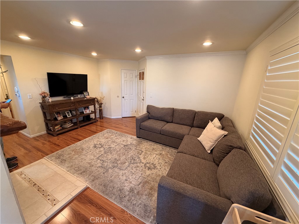 19804 Sandpiper Place, Unit 9 Newhall, CA 91321 - Photo 2 of 27 a living room with furniture and a flat screen tv