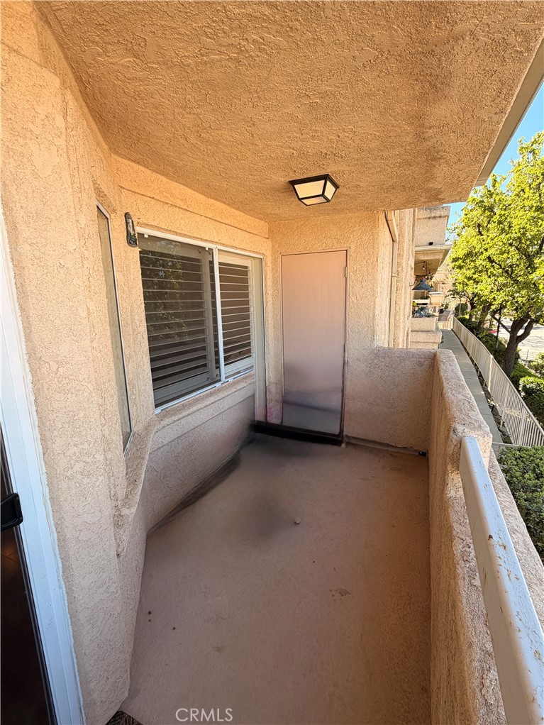 19804 Sandpiper Place, Unit 9 Newhall, CA 91321 - Photo 21 of 27 a view of a house with an empty room