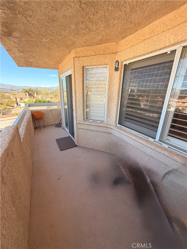 19804 Sandpiper Place, Unit 9 Newhall, CA 91321 - Photo 22 of 27 a view of balcony with furniture