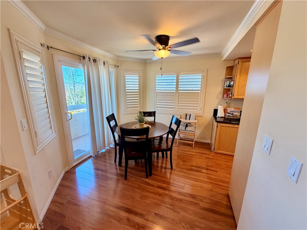 19804 Sandpiper Place, Unit 9 Newhall, CA 91321 - Photo 5 of 27 a view of a dining room with furniture and wooden floor