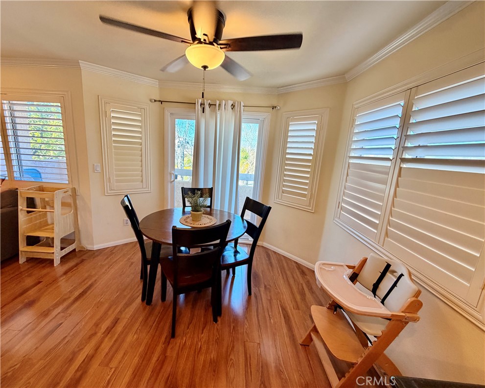 19804 Sandpiper Place, Unit 9 Newhall, CA 91321 - Photo 6 of 27 a view of a dining room with furniture and wooden floor