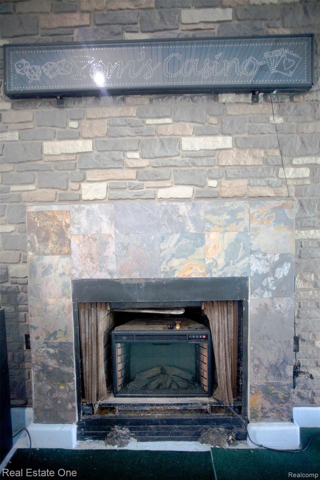 42560 Willis Road Belleville, MI 48111 - Photo 24 of 70 FIREPLACE IN POOL ROOM