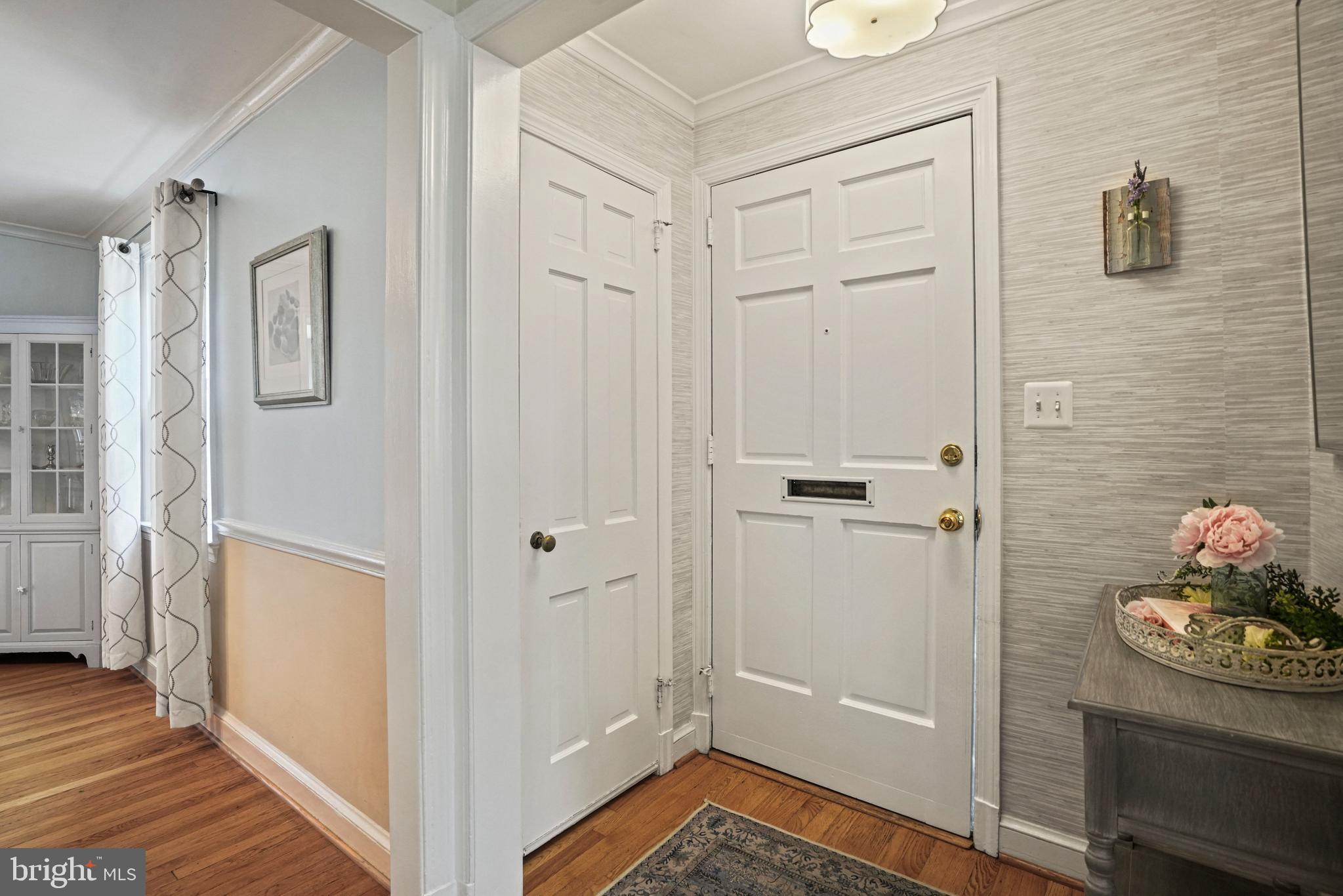 1907 Brisbane Street Silver Spring, MD 20902 - Photo 3 of 39 a view of a hallway with wooden floor and a bathroom