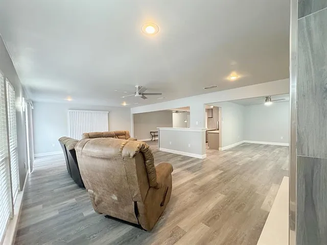 a view of a livingroom with furniture and wooden floor