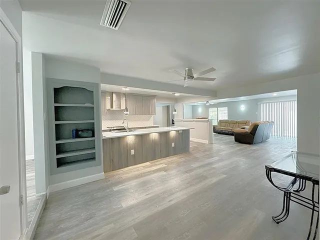 a kitchen with a sink cabinets and counter space