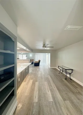 a view of kitchen and wooden floor