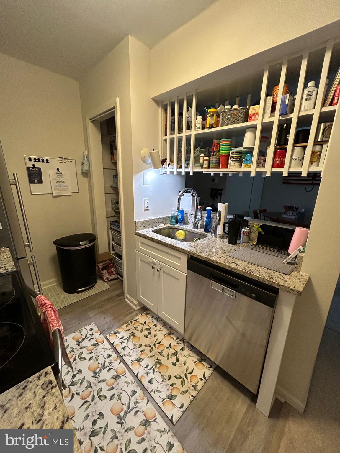 5821 E Royal Ridge Drive, Unit E Springfield, VA 22152 - Photo 11 of 20 a kitchen with a sink and a stove top oven