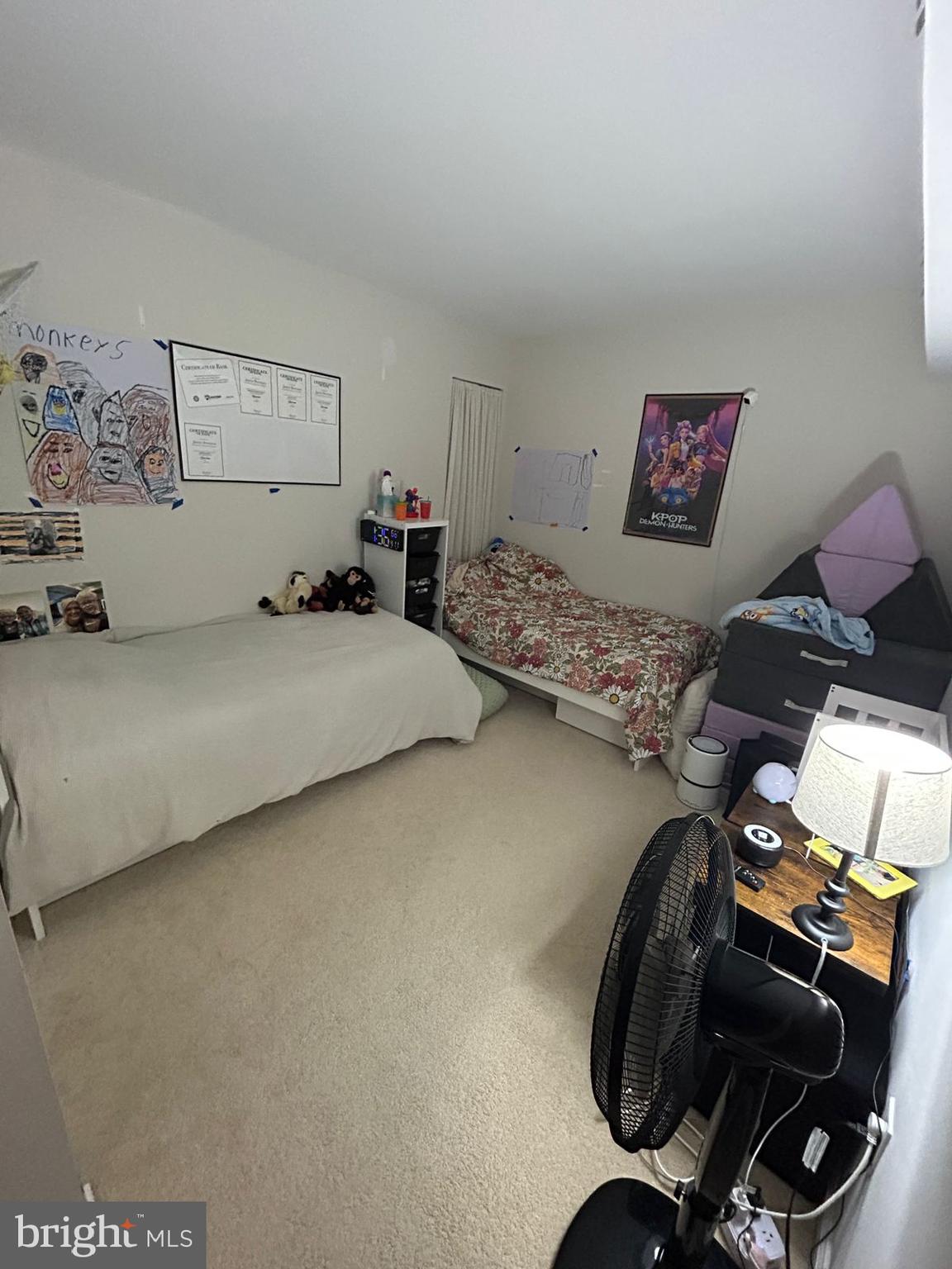 5821 E Royal Ridge Drive, Unit E Springfield, VA 22152 - Photo 12 of 20 a bedroom with bed and a chair