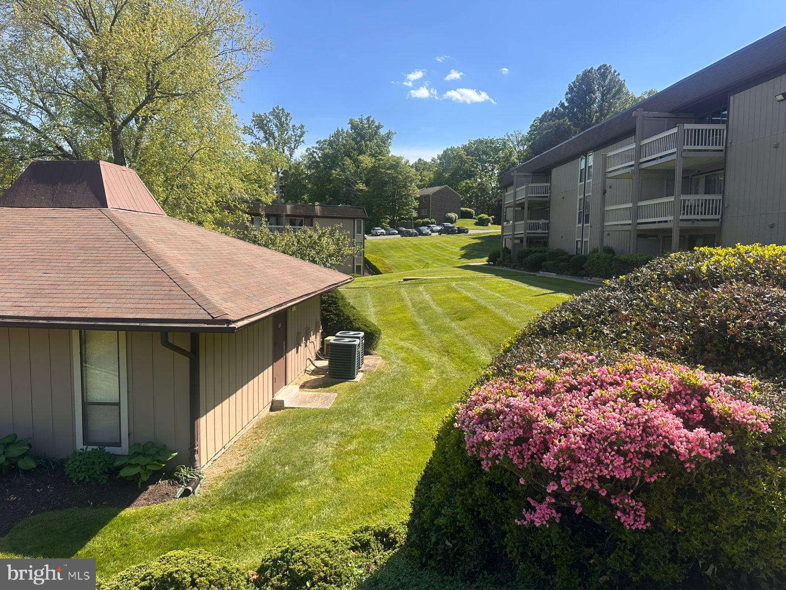5821 E Royal Ridge Drive, Unit E Springfield, VA 22152 - Photo 15 of 20 a view of an house with backyard space and garden