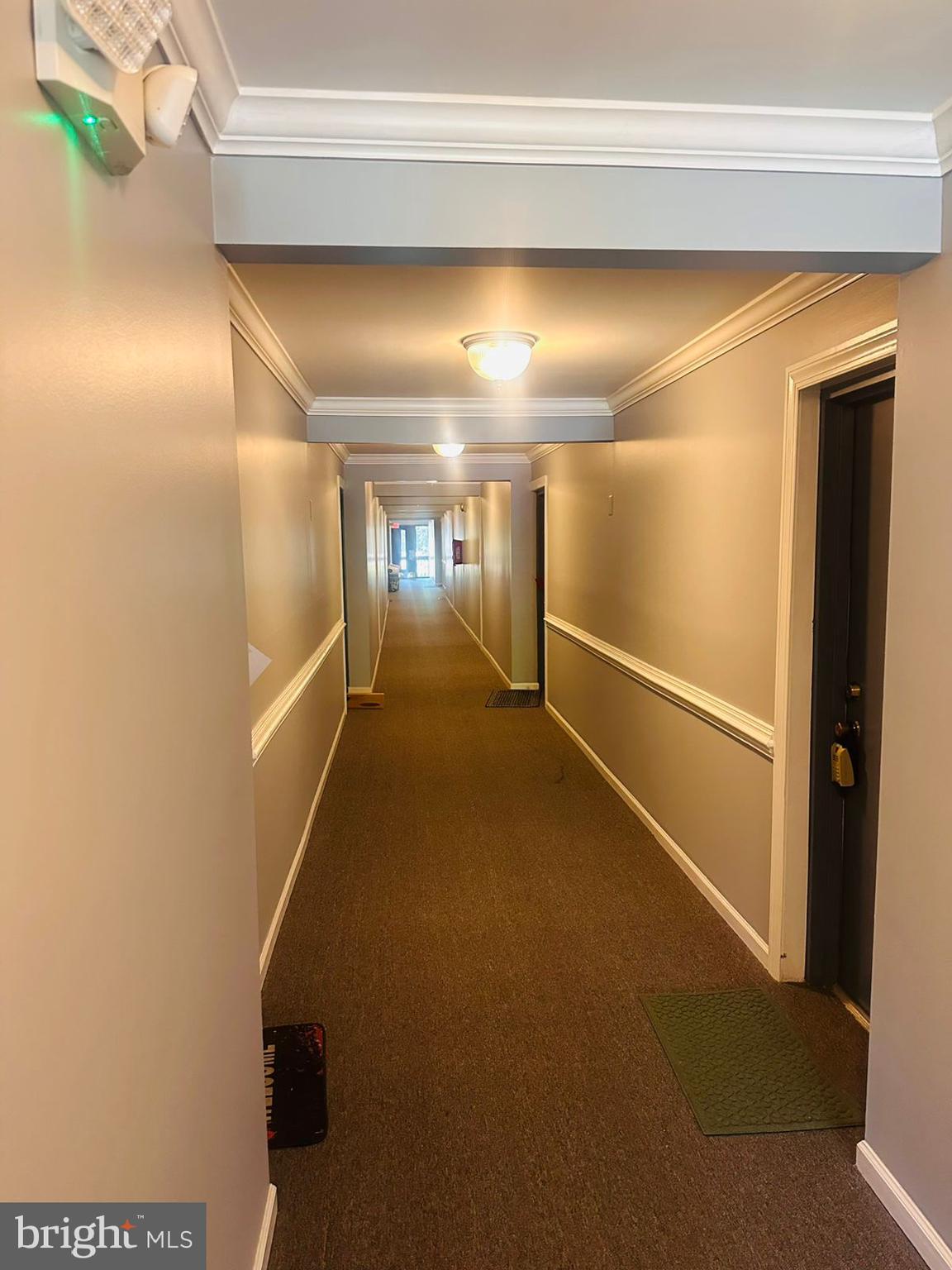 5821 E Royal Ridge Drive, Unit E Springfield, VA 22152 - Photo 5 of 20 a view of gallery with wooden floor