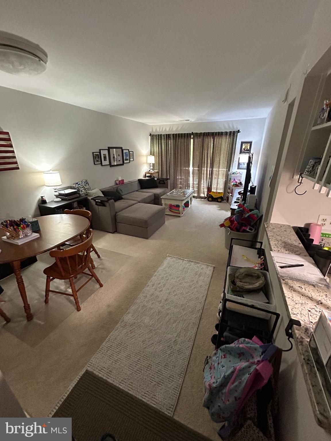 5821 E Royal Ridge Drive, Unit E Springfield, VA 22152 - Photo 7 of 20 a bed room with furniture and a window