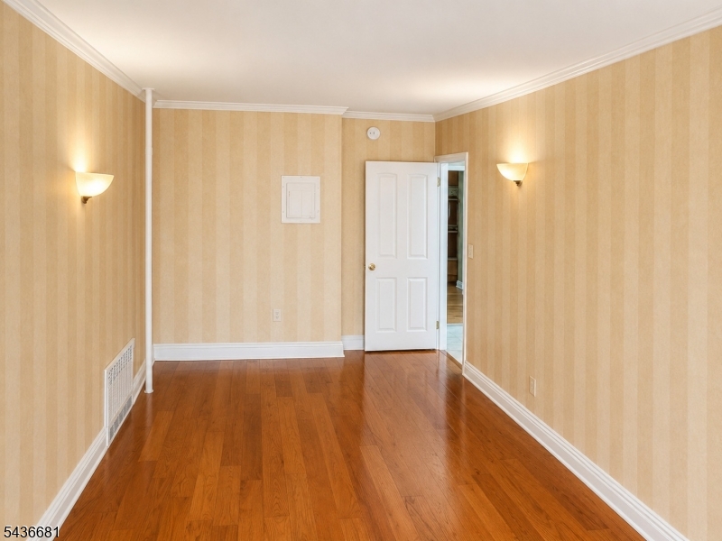 178 East Lindsley Road, Unit 2 Cedar Grove, NJ 07009 - Photo 14 of 28 a view of an empty room with wooden floor and a window