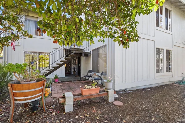 a front view of a house with outdoor seating