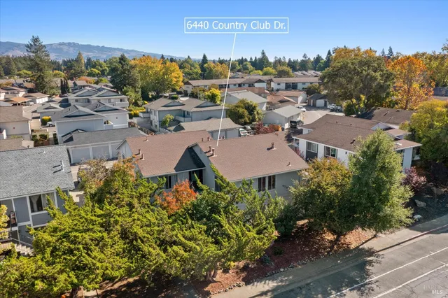 an aerial view of a house with outdoor space