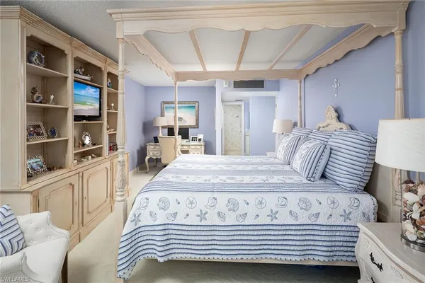 a bedroom with a bed and a cabinets