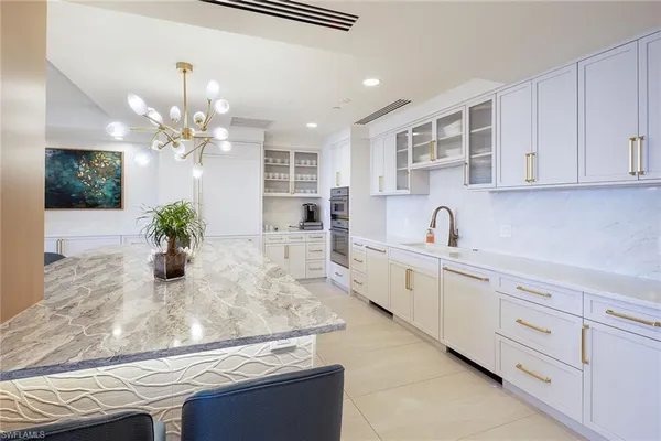 a kitchen with cabinets and window