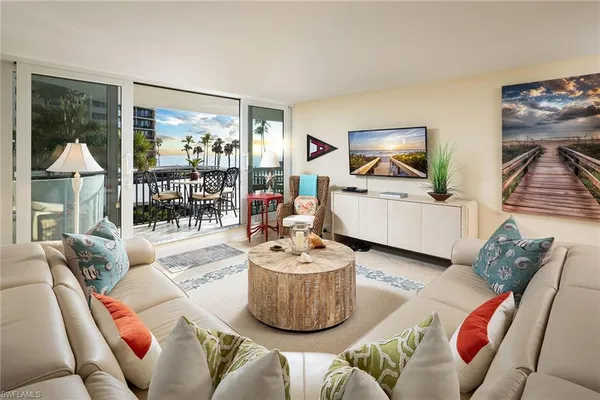 a living room with furniture and a large window