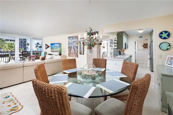 a dining room with furniture and wooden floor