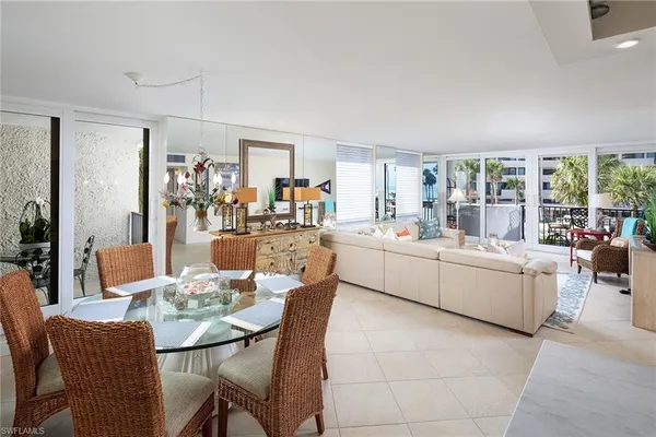 a large kitchen with a table and chairs in it