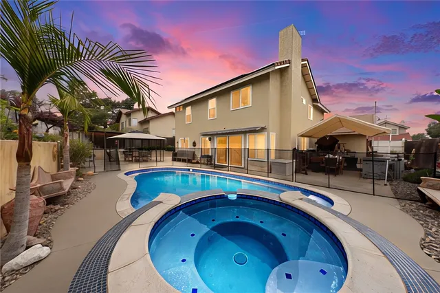 a view of outdoor sitting area with swimming pool