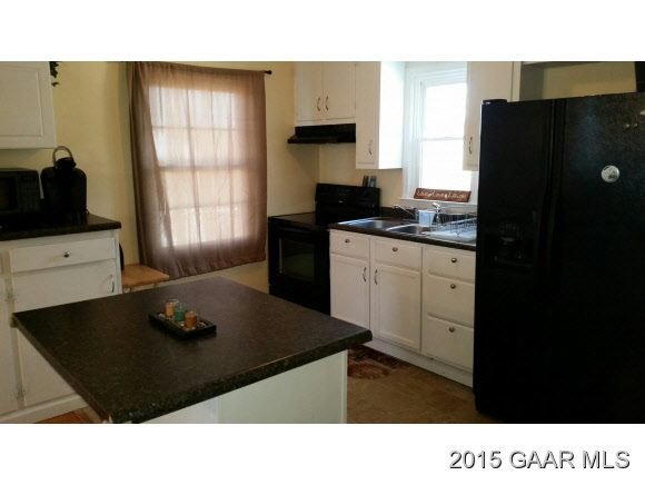 422 Steeles Fort Road Raphine, VA 24472 - Photo 7 of 10 a kitchen with a refrigerator and a stove