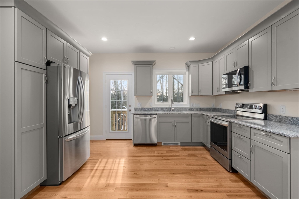 5 Miles Road Rutland, MA 01543 - Photo 13 of 37 a kitchen with stainless steel appliances granite countertop a refrigerator and a stove top oven
