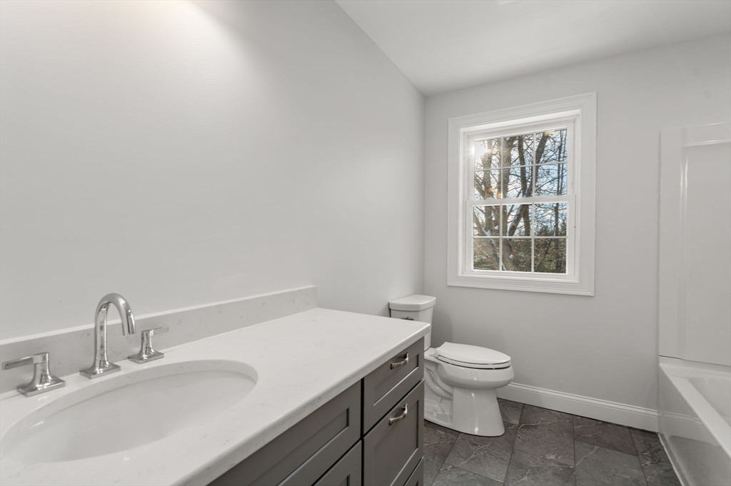 5 Miles Road Rutland, MA 01543 - Photo 26 of 35 a bathroom with a sink a toilet and a window