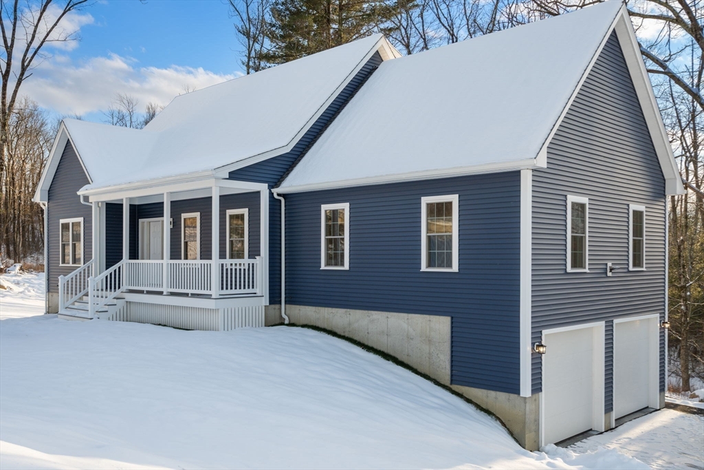 5 Miles Road Rutland, MA 01543 - Photo 3 of 37 a front view of a house with large windows