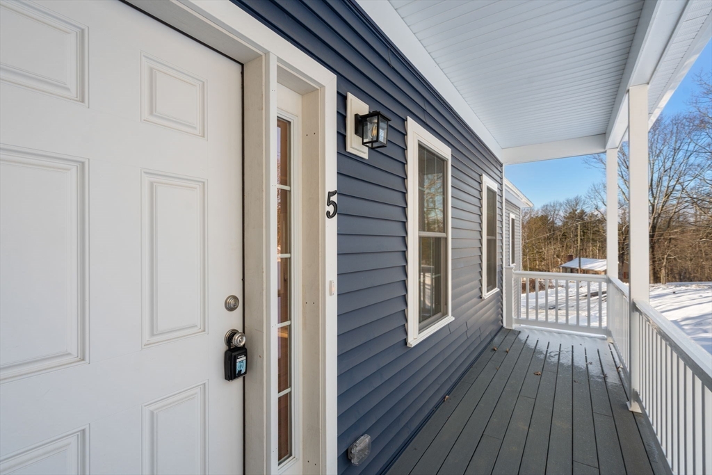 5 Miles Road Rutland, MA 01543 - Photo 7 of 37 a view of a balcony with wooden floor and fence