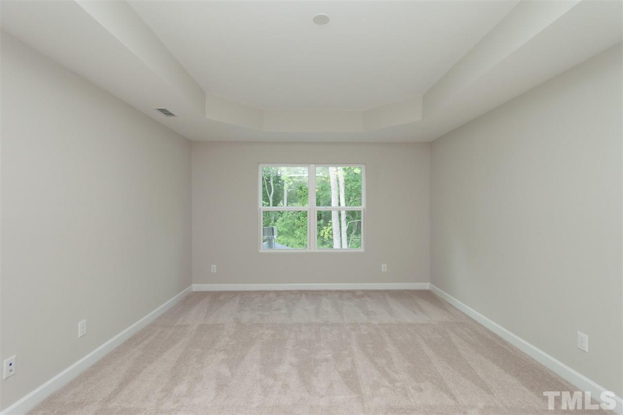 113 Spring Pine Lane Holly Springs, NC 27540 - Photo 12 of 25 an empty room with a window