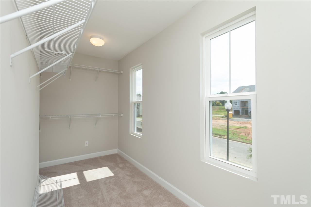 113 Spring Pine Lane Holly Springs, NC 27540 - Photo 14 of 25 an empty room with windows