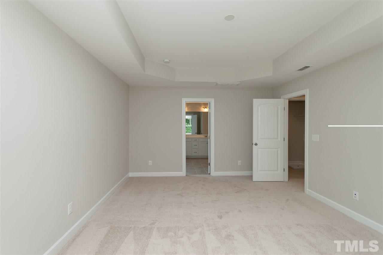 113 Spring Pine Lane Holly Springs, NC 27540 - Photo 15 of 25 a view of an empty room with window