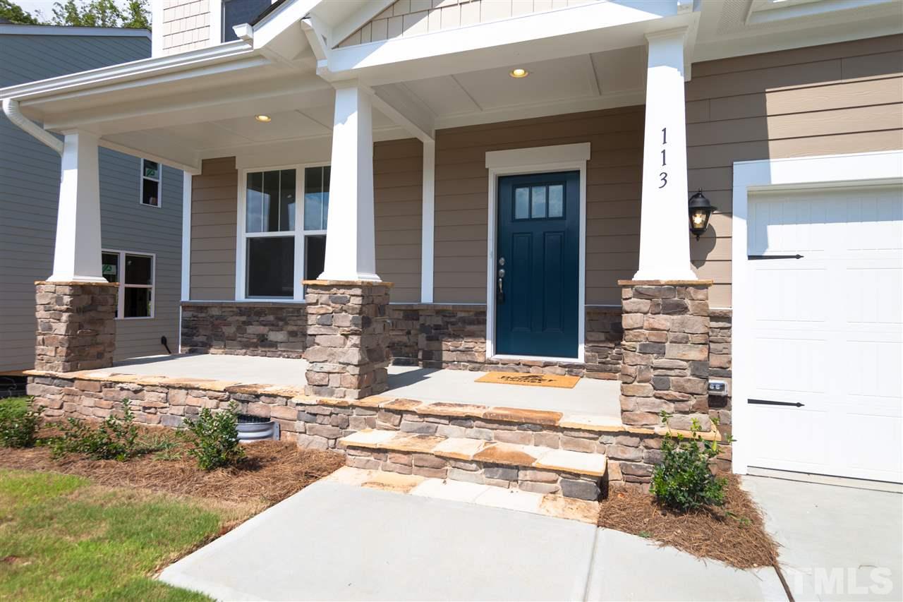113 Spring Pine Lane Holly Springs, NC 27540 - Photo 2 of 25 a view of a lobby with a fountain