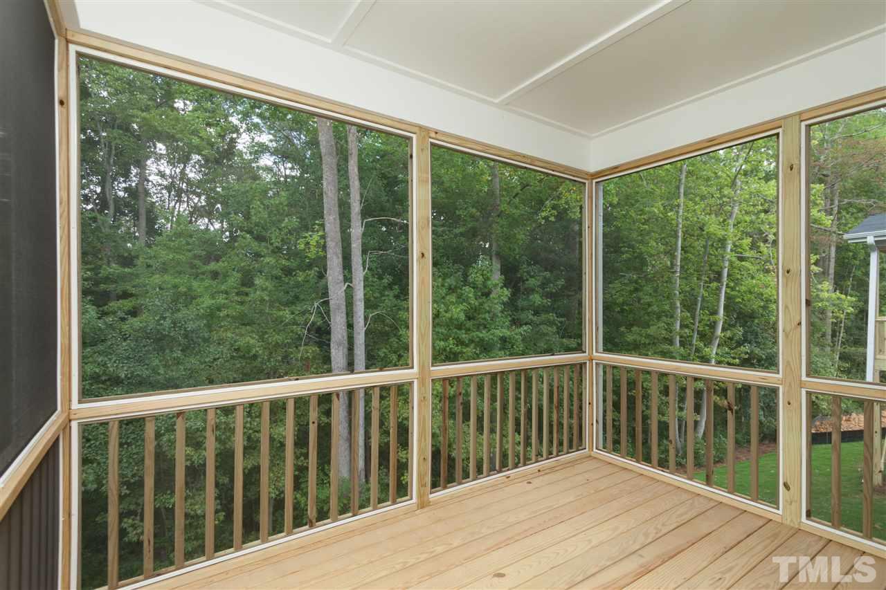 113 Spring Pine Lane Holly Springs, NC 27540 - Photo 23 of 25 a balcony view with wooden floor and outdoor space