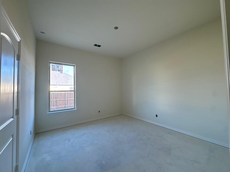 114 Brandywine Trail Rhome, TX 76078 - Photo 11 of 17 a view of an empty room with a window